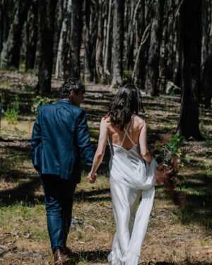 Geraldine Hakewill Instagram - When Mark and I surprised our family and got married over Christmas I was very lucky to have my 11th hour dress made for me by my friend @biancaspender 🌸 It was like a second skin and it helped me feel effortlessly glam and special. She is releasing a new bridal collection soon and you could wear your very own creation down the aisle/forest path/jetty… I can highly recommend.
Mark had his linen suit custom made by the amazing @annacordell_ and we both wore our @rmwilliams boots. Our local flower farm made my bouquet @fleurs_de_lyonville and a beautiful neighbour and now friend @clairderwortphotography took our photos. Another friend @i_am_jika made our rings from recycled gold. 
I did my own hair and make up which the wind and my tears quickly made short work of. I got sunburnt shoulders and felt giddy and couldn’t stop smiling all day.