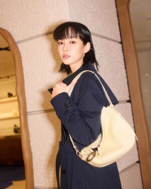 Gladys Li Instagram - Wrapped in the classic allure of Burberry’s trench and carrying the new Knight Bag, I move through the world with an effortless grace
@Burberry #Burberry 
@HarbourCity #HarbourCity