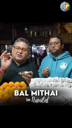 Gopal Dutt Instagram - @kunalvijayakar & @gopaldatt savouring the best Bal Mithai in Nainital at Mamu’s Naini Sweet House! 😋

Bal mithai is a brown chocolate-like fudge, made with roasted khoya and coated with white balls made of sugar coated roasted poppy seeds. It is a popular sweet from Kumaon, India. ✨

If you have had Bal Mithai, tell us in the comments below! ⬇️ share this reel with your Pahadi friends! 🫂

#gopaldatt #kunalvijayakar #balmithai #kumaon #nainital #sweets #uttrakhand #nainitalstreetfood