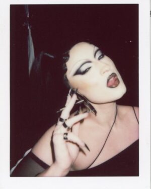 Gottmik Instagram - No falsies no problem!⛓️🔥🖤
My first-ever beauty campaign for KVD’s new Full-Sleeve Tubing Mascara and Tattoo Pencil Liner. I’m wearing the shades Chromite Black, Pearls par White, and Trooper Black. Available now at @sephora !
I started doing drag to push boundaries and it was such a punk rock form of art. I think that really transferred over to the way I look at beauty—I love always pushing limits and pushing my creativity to the fullest, which is what KVD is all about.
I'm so honored to be a part of this campaign and I hope you love this mascara as much as I do! It’s truly a Full-circle moment with @kvdbeauty, a brand I’ve loved for years as a goth diva 🖤
Makeup Artistry: me & @alliesmithmakeup Photographer & Director: @christian_ferretti Hair: @edwardlampley c/o CLM
Styling: @markpaul_
Set Design: @twohawksyoung
Makeup Assistants: @zacmakeupartist @ionamouramakeup 1st Photo Assistant: @markgrgurich
2nd Photo Assistant: @davideristavi
Digital Tech: @digikenseth
Styling Assistant: @in_d_yuh
Hair by @edwardsizzahands2.0 
Hair Assistants: @katarlina_ @thestylist.Jamie
Manicurist: @honeynailz

Creative Director: @paultrapani, @helloangelica Producers: @cmeshesh @jea_nelly

#KVDxGottmik #FullSleeveMascara #TattooPencilLiner #KVDFace