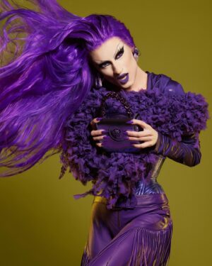 Gottmik Instagram - 💜MONOCHROMATICA💜  @versace SS 2023 was this first Versace show I attended right after doing my first campaign with the house. I remember being so excited and wanting to wear it ALL so coming full circle and being able to wear these iconic pieces together on the main stage of @rupaulsdragrace was insanity 💜 thank you to the entire @versace team for making this happen I love you forever 💜
Makeup inspired by @patmcgrathreal for the Versace FW 23 show 
Hair by @jeanbaptiste.santens 
Photo by @sanchezzalba
Look by @versace @donatella_versace