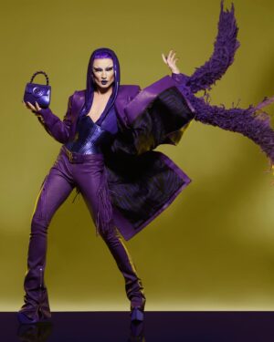 Gottmik Instagram - 💜MONOCHROMATICA💜  @versace SS 2023 was this first Versace show I attended right after doing my first campaign with the house. I remember being so excited and wanting to wear it ALL so coming full circle and being able to wear these iconic pieces together on the main stage of @rupaulsdragrace was insanity 💜 thank you to the entire @versace team for making this happen I love you forever 💜
Makeup inspired by @patmcgrathreal for the Versace FW 23 show 
Hair by @jeanbaptiste.santens 
Photo by @sanchezzalba
Look by @versace @donatella_versace