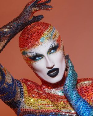 Gottmik Instagram - The scream by Edvard Munch 1893 
.
Over 500,000 crystals in 50 different colors and over 1000 hours to complete.
This dress was a labor of love and another very iconic moment for me. @thediscodaddy is the only artist I have ever met that would be able to do create this level of artistry and I am so honored to have been able to wear this piece of art on the @rupaulsdragrace stage! ✨🖼️

Photo by @sanchezzalba 
Dress construction by @marcosquared