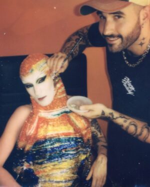 Gottmik Instagram - The scream by Edvard Munch 1893 
.
Over 500,000 crystals in 50 different colors and over 1000 hours to complete.
This dress was a labor of love and another very iconic moment for me. @thediscodaddy is the only artist I have ever met that would be able to do create this level of artistry and I am so honored to have been able to wear this piece of art on the @rupaulsdragrace stage! ✨🖼️

Photo by @sanchezzalba 
Dress construction by @marcosquared