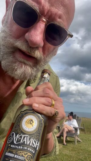 Graham McTavish Instagram - It’s been a while but it’s time for road test number 4. Sheep, bourbon, cabbage trees….what can possibly go wrong. With thanks to the elegance of @garancedore the pretty fabulous view and, of course, the booze hungry sheep of New Zealand @mctavishspirits #roadtestingbourboninnaturebarefoot #thewarchief #bottledinbond #drinkingwithawoolybackdrop