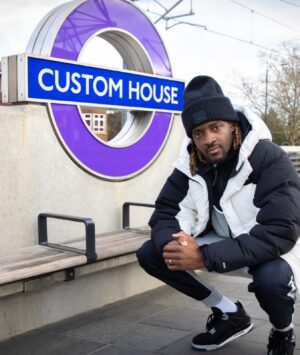 Guvna B Instagram - It was probably cos Danny Dyer couldn’t make it 😂 but I’m honoured to be the face and voice of Custom House, as part of the new Elizabeth Line audio guides. Growing up here life could have gone another way. There’s obviously unlimited distractions and negative influences which is a result of poverty and I know my face could have been plastered up in the ends for a completely different reason, but I’m thankful to the village for looking after me. 

From my boys, my parents, lil bro, neighbours, youth club, bossman at the corner shop all the way down to the bus driver that would still let me on when I didn’t have p’s. Everyone played their part. 

Catch me on ITV news today talking about it, and I hope this shows that your environment can provide some very real challenges, but it is possible to overcome them. 🏚️ 

Special thanks to @transportforlondon