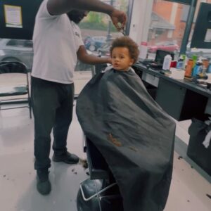 Guvna B Instagram - Ezzy’s first trim. A lot of people talk about the importance of discussing the birds and the bees with your kids, but long before that they need to know about the importance of a Barber. A lot of man seeing a different barber every week 🫣Can’t trust them man. Certain man seeing other Barbers behind their Barber’s back and posting pics with their hair cropped out. Don’t know how they sleep at night 🤢🫠 I’m not perfect. Had a weak moment a few years ago and got a cut while on holiday. Thought I got away with it but @damonno1barber asked me mid-trim “You’ve seen someone else haven’t you?” He wasn’t angry, just disappointed. It broke me man 💔 Shout out all the Barbers though. Aka counsellors, guardians, peace makers, pillars of the community. God protect you as you protect our hairlines. 🙏🏾