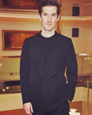 Gwilym Lee Instagram - Lovely to be invited by @criticscircle to announce the nominees for the 42nd London Critic’s Circle Film Awards. Congratulations to all the nominees. Thanks for having me and for reuniting me with @joannavanderhamofficial! The last time we were together we were playing starving teenagers in war torn Russia in ‘The Promise’ for @donmarwarehouse. Nice to be back together…looking a little less dishevelled this time! 

Thanks to @dunhill @mrp and @grensonshoes for suiting and booting me. And to @jayhines_ for making me look sharp!