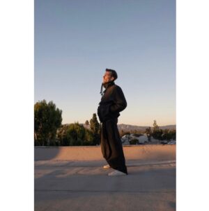 Gwilym Lee Instagram - This is the sad reality of Vitamin D deficiency in us pale, pasty Brits. Here you see the desperate scramble to find the last shards of sunshine at the end of the day as I stand on a rooftop in the LA sunset to have a chat with @contentsmen Head over to their page to have a look 

Creative director: @deborahfergusonstylist 
Photography: @cullywright 
Grooming: @dannidoesit 
Fashion assistant: @juan.mar.co 
Clobber from @kenzo 

#vitamind #vitaminddeficiency #contentsmanmagazine #la #thegreat #kenzo