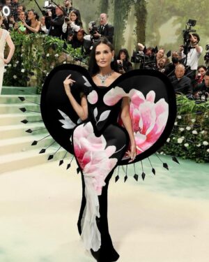 Harris Reed Instagram - Demi Moore in Demi Couture …  god you have no idea how long I’ve been waiting to write that.

As I woke up this morning in New York, I looked in the mirror brushing my teeth and couldn’t hold back my tears. To be 27 and attending the Met Gala with my namesake fluid, London brand, asked to attend with Vogue, and dress a woman I have been obsessed with ever since I watched Ghost and Charlie’s Angels, a woman with such strength, beauty and power… it’s DEMI FUCKING MOORE and having her and her fucking beyond stylist @bradgoreski to collaborate with on my DREAM dress does not feel real. To be able to take old wallpaper and soak it and repurpose it onto these pieces has been such a treat, to play with something so delicate and fragile and give it a second life. To make almost life size paper dolls, a flower in perfect bloom as its decays fully wrapped in thorns. This moment isn’t about me it’s about all the incredible women around me who push this now not-so-little boy’s dream into realities, to let me create these pieces and fantasies; @daisy_hoppen, @phoebebluecobb, Nana Baehr, @hannnahsheridan , mom... the sketch is nothing without the army of LOVE!

I know to a lot of people my life might look fully calculated, and that I know exactly what I’m doing, but I’m just making it up every day, taking on challenges and hustling my little butt off and following my gut. 

Thank you to everyone on here for supporting these life altering moments like The Met Gala. To my husband who holds me through all of this and is truly my guiding light @eitansenerman 

A special thank you to the extraordinary @bradgoreski for bringing me on board to a fabulous project I couldn’t have done without him. To my @fromentaldesign family and for the endless love and day and night painting of petals and allowing me to raid your wallpaper archive. And finally my London design team @brandontan1128 , @ryxwu @hannahsheridan , we did it! And of course to Anna Wintour and everyone at @voguemagazine for their incredible support from the very start of my journey, it means the world. 
Makeup : @sofiatilbury @charlottetilbury 
Hair : @peteburkill @dyson 
Jewerly : @cartier 
Glow: @drbarbarasturm @mosshave