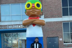 Hebru Brantley Instagram - New statue 🚨! Flyboy has a permanent home at @navypierchicago When I first started my career as a visual artist I dreamt of having a public sculpture in my home town. This weekend that dream came true. All smiles as history is made. Thank you to everyone That has helped through their support their love or their hard work to make this a reality. I wouldn’t have made it to this point without you. Special thx to the Wong family We just getting started!  #chicago #navypier #navypierchicago #grateful #nevermorepark #flyboy @hidden_s_rank