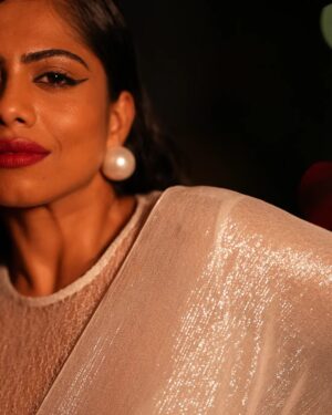 Henna Bella Instagram - @hennabella_4 as the November Bride.

Wearing a Silk Georgette saree with silver zari and a lace high-neck blouse from @saltstudio 

Paired with over-sized pearl earrings from @dhora_india and a silver finger ring with red stones from @amrapalijewels Both these pieces of jewellery are available at the @saltstudio Kochi store.

I would recommend this Indian Christian bridal look for an evening wedding. The shimmery saree would work brilliantly for night-time photography. The pallu can be draped over the head and doesn't require an additional veil. The saree itself is lightweight and offers an ease of wear that heavily embroidered sarees and kanchipurams don't.

Outfit: @saltstudio 
Photography: @___.r_e_d.___ assisted by @the.najose 
Concept, Creative Direction and HMU: @priyamaudlin
Assisted on Hair by @enchantbyeapen 

#nighttimephotography
#bridalportraits
#bridalmakeupkochi #bridalmakeupkerala #keralachristianbride #keralamakeupartist #kochimakeupartist #flashphotography
