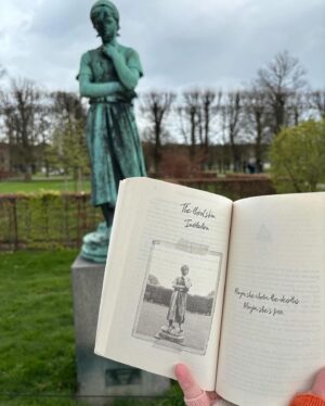 Holly Ringland Instagram - In 2014 when I stood spellbound in Copenhagen in front of the sculpture of Liden Gunver, I remember taking photos of her and thinking as goosebumps went through me, remember her, she means something to you, you just don’t know it yet. It was my first time in Denmark, country of my ancestors, and we were there from Manchester for just a long weekend, a surprise trip from Sam. At the time I was bereaved and felt like a mess; funny how in the depths of that kind of grief we can be wide open for the inexplicable to find us. 8 years later, Liden Gunver became an elemental part of Esther Wilding and her sister Aura Wilding’s stories in my second novel. Now, ten years later, seeing this post from @bookishbron is a kind of wonder I don’t have words to name. Thank you Bron, for blowing my mind and sharing this magic. Maybe she chose the depths, maybe she’s free.
🩵🌸🐦‍⬛
Repost • @bookishbron I started The Seven Skins of Esther Wilding (by @hollygoeslightly) on our flight from Australia to Denmark, and read it as we travelled around the country and back to Copenhagen. I honestly couldn’t have had a better travelling companion than Esther. This was one of those books that I felt in my bones and my heart and my soul. Copenhagen, and later the Faroe Islands felt like characters in the book and I just loved that. I’ve spent a little bit of time living in Denmark in the past, and Esther’s experience of arriving into the place and culture really moved me. A lot about the book moved me to be honest - I was nearly sobbing on the bus reading one part in particular that left me feeling like my chest had been broken open.
This little statue in the photo, Liden Gunver, plays an important part in Esther’s story. She stands outside Rosenborg Castle in Copenhagen, and I couldn’t visit without taking Esther with me! Swipe to see the page from the book featuring Liden Gunver (spoiler-free!)
I might have more to say about this book later, but for now I’m just sitting with the feelings it has left me - it’s one I know will be in my heart for a long time ❤️🇩🇰
*
#BookishBron #EstherWilding #HollyRingland #TheSevenSkinsOfEstherWilding #AusLit #LidenGunver #VisitCopenhagen #RosenborgCastle