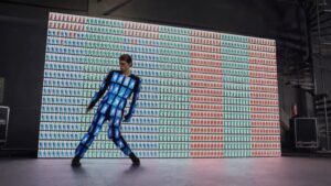 Ian Eastwood Instagram - i will never forget teaming up with creative genius @damiankulash for this @asus ZenFone5 commercial. I am wearing 89 cell phones, dancing in front of 1139 cell phones, and dancing to an @okgo song called “i’m not through”. i am so grateful it wasn’t all just a dream.
•
Going in to this, I already felt OK Go and their music videos had established a new standard and definition of what it means to make a music video. But after being lucky enough to understand the purity behind the work ethic with Damian at the helm, and seeing and understanding every single element of detail and patience that goes into the production of one of these projects is something I never thought I would be lucky enough to experience in a lifetime. I walked away from this piece of art with the feeling of true achievement. and that feeling came from Damian and his entire team that were all so supportive and excited to make something that everyone believed would really be cool. I wish words could explain how inspired this entire experience left me but one thing i will say is one big final grand thank you to Damian for being a truly great mentor and for taking your time to work with an artist like me. it was an honor.
•
thank you to kim and bill hargate costumes, thank you to the graphic designers @iamstatic @artjail, the phone programmers, everyone who helped me in and out of that suit for the three days of shooting and the month leading up to the shoot days, kelli abraham, and my peeps at asus for making this all so special.
•
BTS and full video link in my bio.