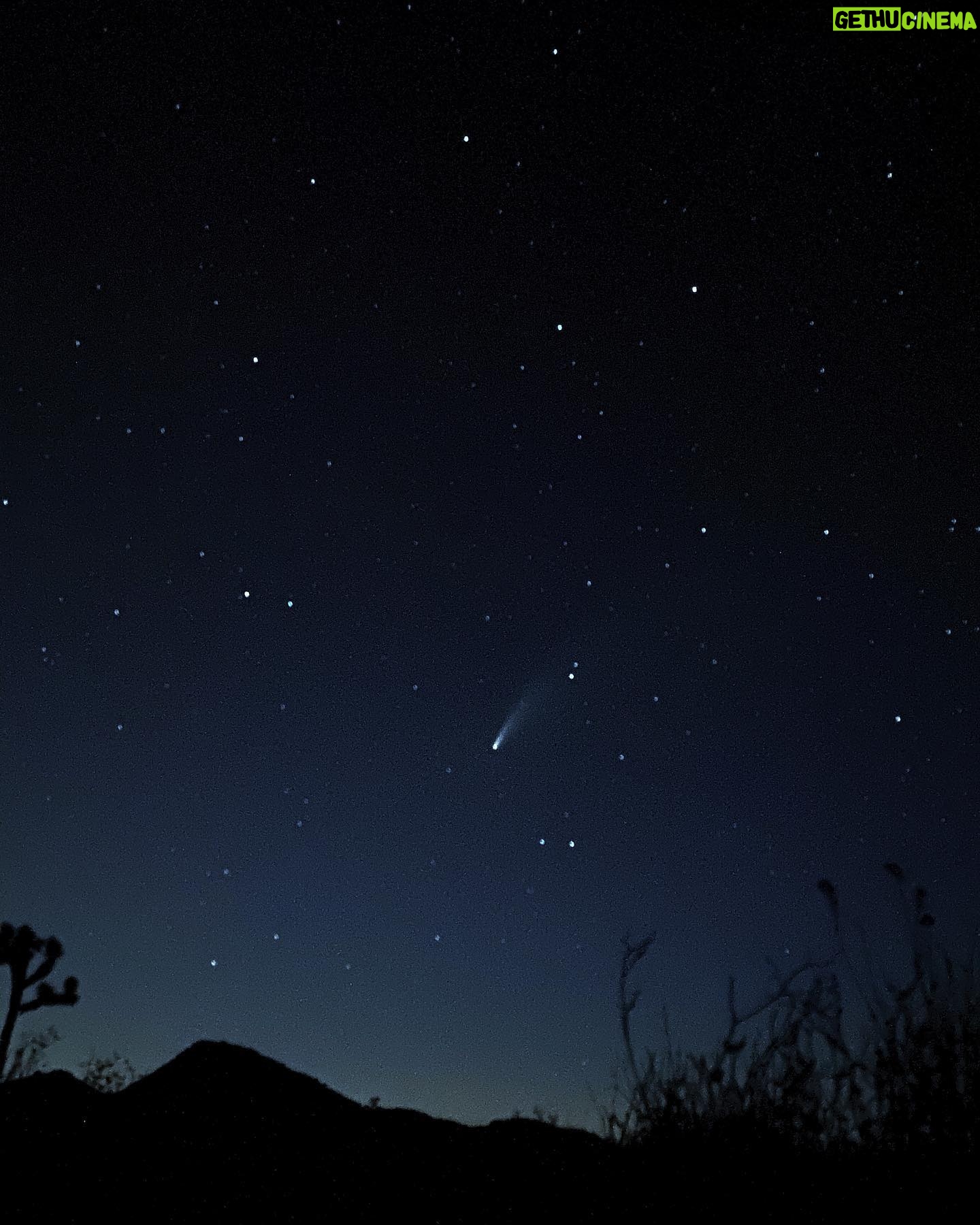 Ioanna Gika - 1.1K Likes - I took this photo of Comet Neowise. Days of looking where sites and apps directed: nothing. Then the faintest tail. (City lights? Halo from contact lenses?) Neowise was ephemeral, but I learned that once I stopped relying on apps to direct me, and let my eyes adjust to the night sky, I was able to spot the unmistakable shimmer of a cosmic brushstroke. As Neowise grew in luminosity, becoming bolder as the sun pulled the curtain of the night, the comet pointed its silvery finger to our planet almost as if to say, ‘Earth, you see me, but make no mistake: in a blaze, I am watching you.’ 20 minutes and it was gone.