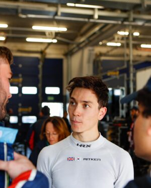 Jack Aitken Instagram - First race at ‘The Green Hell’. Walking away with a class win, a surprisingly heavy bag of meat, and very wide eyes! 

Getting your Permit for the infamous Nordschleife circuit isn’t a simple one, for good reason. You need to take a series of theory and practical courses, before accumulating 18 race laps in the lower powered classes, like the one I raced here, snappily named VF2-FWD. There are an absolute litany of classes here (see my meme), but ours is basically a stripped-out road car with slicks. This means it’s actually harder to drive than a full blown GT3 racer, lift-off oversteer is real. 😅

I was lucky to be with people who know what they’re doing, @walkenhorstmotorsport, and my teammates @baileyvoisin and @manuel_maldonado33. I did the first half of our 4hr race, and my gosh the things I saw… 😂 As well as epic slipstream battles on the 2.5km Döttinger straight, I drove with my eyes in the mirror as faster cars sailed past at impossible speeds for my poor little Hyundai, drove past flatbed trucks on their way to recover cars that had crashed somewhere on this mammoth 21km ‘track’ and scared myself silly a few times when the already-close barriers starting inching closer… 

I somehow (genuinely, no idea how) got us from P4 in class to the lead at the halfway mark. My teammates finished it off to take a win on my first attempt at the Nordschleife! I should really walk away now with the 100% record 😂 

I’ll be back next year to get my remaining laps, for now though attention goes back to our regular schedule with Petit Le Mans next week…
