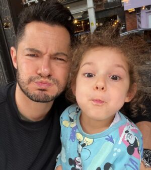 Jake Graf Instagram - Drowning out the Election noise with some Dad and Millie time.😊

As the leaders of both main parties fall over themselves to show their transphobia, the British public is once again left having to vote for the 'lesser of two evils'. Good times. 🤦🏻‍♂️

#vote #toriesout #liberaldemocrats #votegreen #lgbt #trans #dad #father #baby #smile