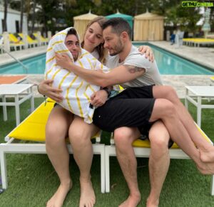 Jake Graf Instagram - This week 4 years ago, Jake and I were on our Babymoon in Miami, enjoying a brief last break together as a twosome, while we waited for our Millie to arrive.

I was very ill for the first few days, unaware of why I couldn't taste or smell anything, and we watched as the world began to shut down around us. 

Jake and I got back on one of the last flights home from the US, arriving in Ireland soon after as travel bans came in, getting to Belfast many weeks ahead of Millie's birth, but grateful to be there. 

So much has happened in 4 years, but that last week with friends in the sun, awaiting our daughter's birth before the world imploded, will always remain etched in my memory. 

#sun #miami #couple #holiday #babymoon #lgbt #trans #family