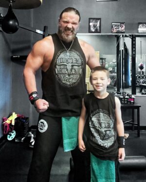 James Cox Instagram - I’m going to be in trouble with this one. He already says he wants to be a wrestler 😂. I had to get him matching James Storm merch. 

#workout #dad #son #jamesstorm