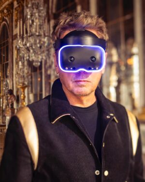 Jean-Michel Jarre Instagram - Engineered in France, the LYNX-R1 headset will play a central role during my performance. Thanks to mixed reality, I will be able to access my futuristic vision & my re-creation of the Hall of Mirrors in the metaverse. The Lynx-R1 will allow me to share a simultaneous experience with the audience present in the Hall of Mirrors and all of you in the metaverse through my virtual avatar. See you there next Monday! 

#LynxMixedReality #LynxR1 #MixedReality #FrenchTech