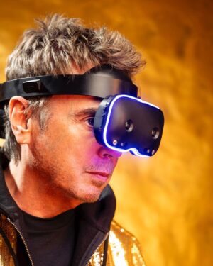 Jean-Michel Jarre Instagram - Engineered in France, the LYNX-R1 headset will play a central role during my performance. Thanks to mixed reality, I will be able to access my futuristic vision & my re-creation of the Hall of Mirrors in the metaverse. The Lynx-R1 will allow me to share a simultaneous experience with the audience present in the Hall of Mirrors and all of you in the metaverse through my virtual avatar. See you there next Monday! 

#LynxMixedReality #LynxR1 #MixedReality #FrenchTech