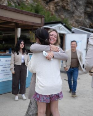Jim Lee Instagram - Last weekend, we celebrated our daughter @brittanym.jpg’s engagement to her boyfriend @s4rge_ by hiding behind some tabletops at the @terranearesort cliffs overlooking the Pacific and witnessed Brandon pulling off a master class on how to create the most romantic surprise—an amazingly sweet, thoughtful and beautiful proposal. Afterwards, we jumped out from our hiding spots, all teary eyed, and gave big hugs to the newly engaged couple, followed by an incredible meal with all the immediate friends and family who had assembled for this unique and special moment!  Over 8 billion people on this blue planet and these two—Brittany and Brandon have found their special someone in each other, and in the process, changed each other’s lives for the better.  To paraphrase Huey Lewis and the News— power of love is not to be trifled with. 😍Wishing these two lovebirds a joyous and love filled engagement as they plan their upcoming big day and the start of their beautiful life together as one. ❤️❤️❤️