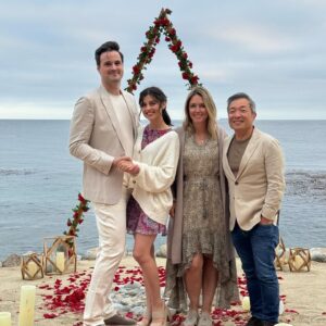 Jim Lee Instagram - Last weekend, we celebrated our daughter @brittanym.jpg’s engagement to her boyfriend @s4rge_ by hiding behind some tabletops at the @terranearesort cliffs overlooking the Pacific and witnessed Brandon pulling off a master class on how to create the most romantic surprise—an amazingly sweet, thoughtful and beautiful proposal. Afterwards, we jumped out from our hiding spots, all teary eyed, and gave big hugs to the newly engaged couple, followed by an incredible meal with all the immediate friends and family who had assembled for this unique and special moment!  Over 8 billion people on this blue planet and these two—Brittany and Brandon have found their special someone in each other, and in the process, changed each other’s lives for the better.  To paraphrase Huey Lewis and the News— power of love is not to be trifled with. 😍Wishing these two lovebirds a joyous and love filled engagement as they plan their upcoming big day and the start of their beautiful life together as one. ❤️❤️❤️