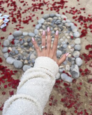 Jim Lee Instagram - Last weekend, we celebrated our daughter @brittanym.jpg’s engagement to her boyfriend @s4rge_ by hiding behind some tabletops at the @terranearesort cliffs overlooking the Pacific and witnessed Brandon pulling off a master class on how to create the most romantic surprise—an amazingly sweet, thoughtful and beautiful proposal. Afterwards, we jumped out from our hiding spots, all teary eyed, and gave big hugs to the newly engaged couple, followed by an incredible meal with all the immediate friends and family who had assembled for this unique and special moment!  Over 8 billion people on this blue planet and these two—Brittany and Brandon have found their special someone in each other, and in the process, changed each other’s lives for the better.  To paraphrase Huey Lewis and the News— power of love is not to be trifled with. 😍Wishing these two lovebirds a joyous and love filled engagement as they plan their upcoming big day and the start of their beautiful life together as one. ❤️❤️❤️