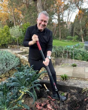 Jimmy Barnes Instagram - First rain free day so it’s me with a pitchfork digging up sweet potatoes. Looks like we’ve got them just in time, some of them are enormous. We’ve got to leave them resting for a few weeks for the sweetness to come in. Who remembers ‘Greenacres’ on TV? That’s me and @jane13barnes . Except Jane can cook a bit, she’s made us a raspberry rocky road frozen yoghurt ice cream.