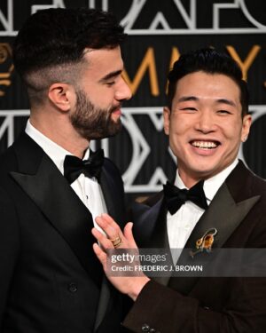 Joel Kim Booster Instagram - Lost, but not feeling like much of a loser this morning. I looked amazing, smooched the love of my life, and got to celebrate this thing that has completely changed my life over the last two years. Everyone should be so lucky. Awards are weird, but this was such a nice way to put this movie to bed. 

Styled by king @chrishoran20 
Face beat by @tracyraffelsonmakeup 
Suit by @toddsnyderny 
Shoes by @giuseppezanotti 
Rings by @davidyurman 
Brooch by Goodwill