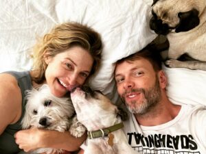 Joel McHale Instagram - Holy crap 27yrs married! Together for 29! Where did the freakin’ time go Sarah?! Still seems like this all happened a couple of months ago. Thanks baby for putting up with me. You deserve a metal and parade. I love you so much. This pic clearly shows whom our dogs(and the greater public) prefer with good reason. They know you’re the best. I’m so lucky. Love you!  #anniversary