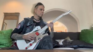 John 5 Instagram - me and Churro waiting for the FedEx guy doing a little fingerpickin