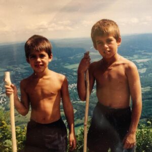 John DeLuca Instagram - He’s always known he was gonna be way stronger than me. I mean look at that flex. And then look at mine - has less effort ever been put into flexing for a photo? Doubt it. He’s been putting me to shame since day 1. 
.
Happy birthday, brother. We can whittle some more super cool walking sticks for a Cali Moto/hiking adventure soon. Keep being a freakin’ legend 👊🏼
.
.
Swipe ➡️ to see @daved311 get way more jacked then me 💪🏼😜

#tbt #glowup