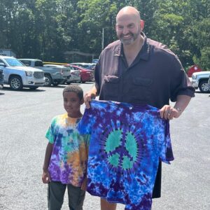 John Fetterman Instagram - Thx to all yinz for coming out to the Penn Ag Dems picnic today – especially the Bedford Co Dems, who made us this beautiful quilt🔥 and @tiedyebytuukka for the shirt☮️ 
I think we can all agree he helped me step up my wardrobe.
