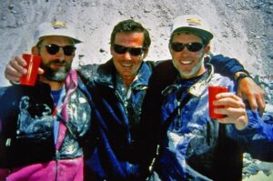 Jon Krakauer Instagram - On this day 26 years ago I shot this photo of the Australian climbing guide Mike Groom on the southeast ridge of Everest at sunrise. I shot the 2nd photo from the summit 8 hours later as cumulonimbus clouds were boiling up from the valley below. A violent storm soon engulfed the mountain, killing 8 people—including my kind, courageous, absolutely wonderful friends Doug Hansen and Andy Harris, seen in the 3rd photo posing with me during the basecamp puja 25 days before the disaster. I still grieve deeply for them. Hit the link in my profile to read more about that terrible day.