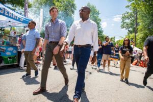 Jon Ossoff Instagram - Walking with my brother @raphaelwarnock today in the Inman Park Festival parade.