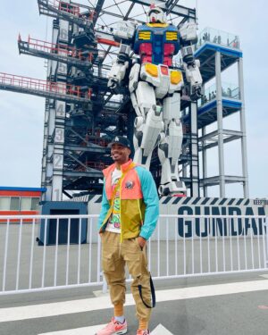 Jordan Calloway Instagram - OK so couple cool facts about the Gundam exhibit:
1. 9 major companies partnered together to take on this project.
2. It’s oooonly 25 tons and simply 60 ft tall 😳
3. COLORS (being a huge thing in Japanese story telling) White: innocence of youth, Blue: hope for the future, Red: burning passion, Yellow: eagerness to end conflict.
4. Why does this matter? Lol this was one of the first anime’s I watched with my late elementary friend, so coming here was also for him. RIP Z. 
🤖😁🤙🏾