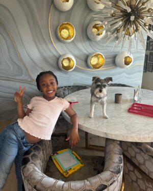 Judge Greg Mathis Instagram - My son Amir owes me a new kitchen table!  Nora and I caught his dog Maya sniffing for crumbs. Nora thought it was cute. Not me!