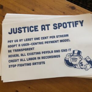 Julia Holter Instagram - This coming Monday, March 15, @weareumaw is holding socially-distant demonstrations outside Spotify offices internationally to deliver our demands to Spotify. Spotify is consistently devaluing music with its practices, and this is affecting all musicians. Covid has left most musicians who make music for a living out of work, as gigs are their main source of income, and yet, since Covid, Spotify has tripled in valuation to around $60 billion. Streaming is 85% of all recorded music income these days, and most of that streaming money is not going to most of the musicians whose music is being streamed, and Spotify dominates the streaming world, in part because of its practices which may be considered to be a kind of predatory pricing. It is urgent we continue to bring our demands to Spotify and to build awareness to the public about its practices. I have been very lucky as a musician, but I’m worried about the future of creative music, and especially worried for musicians just starting out now. It doesn’t have to be this way, and there has to be a change. Please join us wherever your local action is and see you at the LA one which will be from 1pm-2pm
.
Thank you to the great @tomorrowtoday.us for printing our signs here in LA
.
Repost @weareumaw
・・・
Are you fed up with how Spotify pays and treats musicians? Join us March 15 for our worldwide day of action. We're planning 31 socially distanced actions at Spotify offices around the globe. Sign up for your local event here: unionofmusicians.org/justice-at-spotify
#justiceatspotify #payartists #pennyperstream #unionofmusiciansandalliedworkers