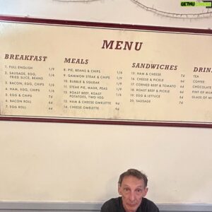 Julian Richings Instagram - Revisiting an old haunt. 
Brown’s caff, The Covered Market, Oxford.
The prices on the menu date back to pre- decimalization. Before decimalization was introduced in 1971, British pound sterling was subdivided into £sd (pounds, shillings and pence).
1 pound = 20 shillings 
1 shilling = 12 old pence (abbreviated to “d”)