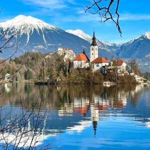 Juliana Dever Instagram - Ugh. We all have the one friend that looks amazing no matter what time of day or season it is.
.
Lake Freaking Bled, you gorgeous piece of nature. How are you always perfect?
.
Hubs and I are having some winter fun in Slovenia with my favorite Tina and her family. Can you believe this is Seamus’s first time here?!?
.
Also, the last picture of Špik mountain was taken as I stepped out of a restaurant at about 6pm. The moon was already full and illuminating the peaks. This is nightmode on my phone, handheld. I’m totally shocked at how crisp it is 🤯
.
#ifeelslovenia #wintertravel #visitslovenia #lakebled #lakebledslovenia