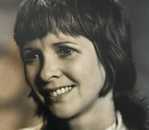 Julie Graham Instagram - It’s 40 years today since my mum died. I was 18. Although it was traumatic and painful, it also made me resilient, brave even. It wasn’t until years later that I realised she had already given me the tools to be able to cope with her loss.  We didn’t always have an easy relationship but I had a very happy, secure childhood and I know she loved me very much. It’s all that matters really. In the end. She was quite the character. Formidable, glamorous, witty, a great raconteur, fiercely political, a passionate socialist. She was on the board of our union Equity and was a staunch feminist. Her  reputation for speaking her mind and  refusing to put up with any bullshit were legendary which came as no surprise when I joined the profession and was frequently told stories about her exploits  which made me more proud of her. Her roots were firmly planted in the theatre, she was a staple in all the big variety circles in Scotland, a panto stalwart but towards the end of her career she worked with some of the best theatre companies playing more dramatic roles. These photos are her in full actress mode, she was a wonderful performer, very funny but had the chops for drama too. She played a character called Marylin Lynch in Scotland’s first soap opera set in Glasgow about the residents of a block of flats called High Living. STV unfortunately destroyed all the reels, an act of cultural vandalism in my mind,  so no footage exists. The first three photos are a still from the set, a publicity postcard and signing autographs with Phil McCall, her beloved on screen husband. The fourth , one of her first head shots. Then good fairy mode, unusual in that she always played the wicked queen/fairy/stepmother. One from a Play for Today. She certainly made her mark. My mama. Betty Gillin 1932-1984 🤍