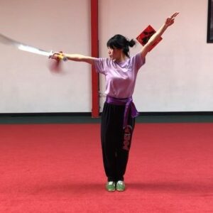 Julie Zhan Instagram - Wushu is my happy place ❤️ #wushu #martialarts #masterhu #straightsword