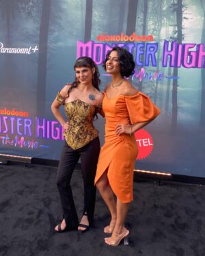 Jy Prishkulnik Instagram - Still screaming from this surreal evening at Paramount Studios with all my beast ghouls🪲💛 

Are you ready for Monster High: The Movie? It’s coming out of the dark in only 2 days☠️💗

PC: @peachhillmedia 

Now for some monster shoutouts: 

Thank you to the most incredible talent team for making my monster dreams come true @symingtontalentmanagement @throughthelooking.glass @characterstalentagency @cesdtalent @pedro_tapia___ @agentmelissabb 

Thank you to the wonderful  @sherylevine for giving this little girl a chance💜 

Thank you to the gruelest glam squad a mummy could wish for
Hair by @hairbaeraul 
Makeup by @makeup_by_jessicarobertson 
Custom corset by @aiko_kivamoto 

You made this vision come to life! 

Thank you for capturing these moments, carrying my Cleo bag, and for your loving care and support @iconicrickyy 

And always to my family for cheering me on from near and far💛🪲

#monsterhigh #monsterhighthemovie #paramountplus #cleodenile #beyourselfbeuniquebeamonster #newmovie #nickelodeon #moviepremiere #bts #mattelcreations #nickanimation