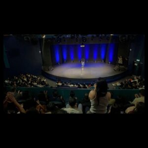 Kanan Gill Instagram - 21 shows, 19 cities, 3 illnesses, 2kg. Touring (parts of) Europe was immensely rewarding. Thank you for coming.
 . . .
“Do you ever worry about becoming a self-parody?”

The clump of moss on the rock face frowned for a minute. “In what sense? It’s your move, by the way”, it said indicating the chessboard stapled to the overhang.

“In the sense of becoming an employee of a previous version of yourself that was free.”

A passing eagle coughed pointedly at how loud we were being. I pressed myself closer to the rock face.

“Nope” said the moss, quite loudly, ignoring my shushing. “Being moss is embracing the plurality of existence, in the sense that there is no singular moss, there are outlines until there is mossing, and that space in which there is moss-ness, is moss. Dude seriously it’s your move.”

The chessboard has no pieces, since we were high up an infinite rock face and it was stapled sideways.

“So you’re talking about being as a process—“

“—A mossess”, corrected the moss.

“But you can still take a sliding window of the continuous change of self and call it who you used to be—“

“—what is this really about?” Interrupted the moss, finally lowering it voice and putting away its Nokia Ngage.

“That I’m worried lasting growth is impossible and decay is inevitable. I keep climbing from epiphany to epiphany, never further off the ground; fingers clasped around realisation, finding the odd abscess of wisdom to rest in. I’ve moved so much, but I’m still here.”

A shower of embarrassed rocks fell past from heights unknown to depths infinite, mumbling apologies. I wept bitterly.

“Ah silly” said the moss ruffling my hair. “There’s nowhere to reach. The path isn’t the climb, it’s the climber. You don’t scale these heights. You hang on till you fall off one day.”

A shuddering relief left my lips. “That’s it?”

“That’s it, smiled the moss. “Now, do you want to play your turn?”

“Sure. Knight to E3!”

“Dude this is Ludo.”