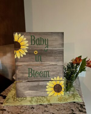 Katie Carpenter Instagram - Baby in bloom 🌻

Thanks to my mama @nancycarpenter27, my sister @alexiscarpenter, and my aunt Patty for making this a special day! 💗 they hand painted all the decor and had a ton of fresh flowers. 🌼 It was intimate and beautiful. 

Things are feeling more and more real. And one of the coolest parts is both my mom and my sister got to feel the baby kick!! 

I was hoping the stars would somehow align but we don’t live close so I didn’t know if it would be possible. Baby showed up for them. 👶🏼

Can’t wait to introduce her in a few months! 

And yes - dress #2 won!! Thanks for all your feedback. 🤗