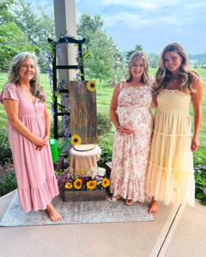 Katie Carpenter Instagram - Baby in bloom 🌻

Thanks to my mama @nancycarpenter27, my sister @alexiscarpenter, and my aunt Patty for making this a special day! 💗 they hand painted all the decor and had a ton of fresh flowers. 🌼 It was intimate and beautiful. 

Things are feeling more and more real. And one of the coolest parts is both my mom and my sister got to feel the baby kick!! 

I was hoping the stars would somehow align but we don’t live close so I didn’t know if it would be possible. Baby showed up for them. 👶🏼

Can’t wait to introduce her in a few months! 

And yes - dress #2 won!! Thanks for all your feedback. 🤗