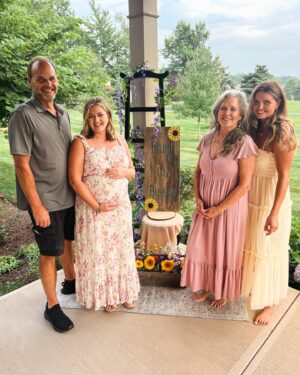 Katie Carpenter Instagram - Baby in bloom 🌻

Thanks to my mama @nancycarpenter27, my sister @alexiscarpenter, and my aunt Patty for making this a special day! 💗 they hand painted all the decor and had a ton of fresh flowers. 🌼 It was intimate and beautiful. 

Things are feeling more and more real. And one of the coolest parts is both my mom and my sister got to feel the baby kick!! 

I was hoping the stars would somehow align but we don’t live close so I didn’t know if it would be possible. Baby showed up for them. 👶🏼

Can’t wait to introduce her in a few months! 

And yes - dress #2 won!! Thanks for all your feedback. 🤗