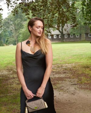 Kaylee DeFer Instagram - Embrace the elegance of darkness with this stunning black dress. 

Classic yet captivating, it's the embodiment of timeless style. 🖤 

📸: @lorinklarisphotography 
.
.
.

#blackdressmagic #eleganceinblack #timelessbeauty" #shelterisland #shelterislandny #shelterislandnewyork
