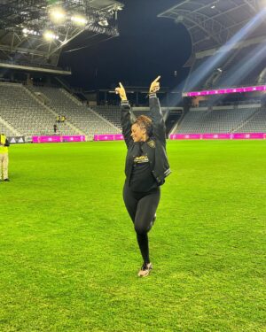 Kimrie Lewis Instagram - Baby’s first time on the field.  Dale @lafc 🖤💛 ⚽️ 📷/hypebestie: @soulglowgirl